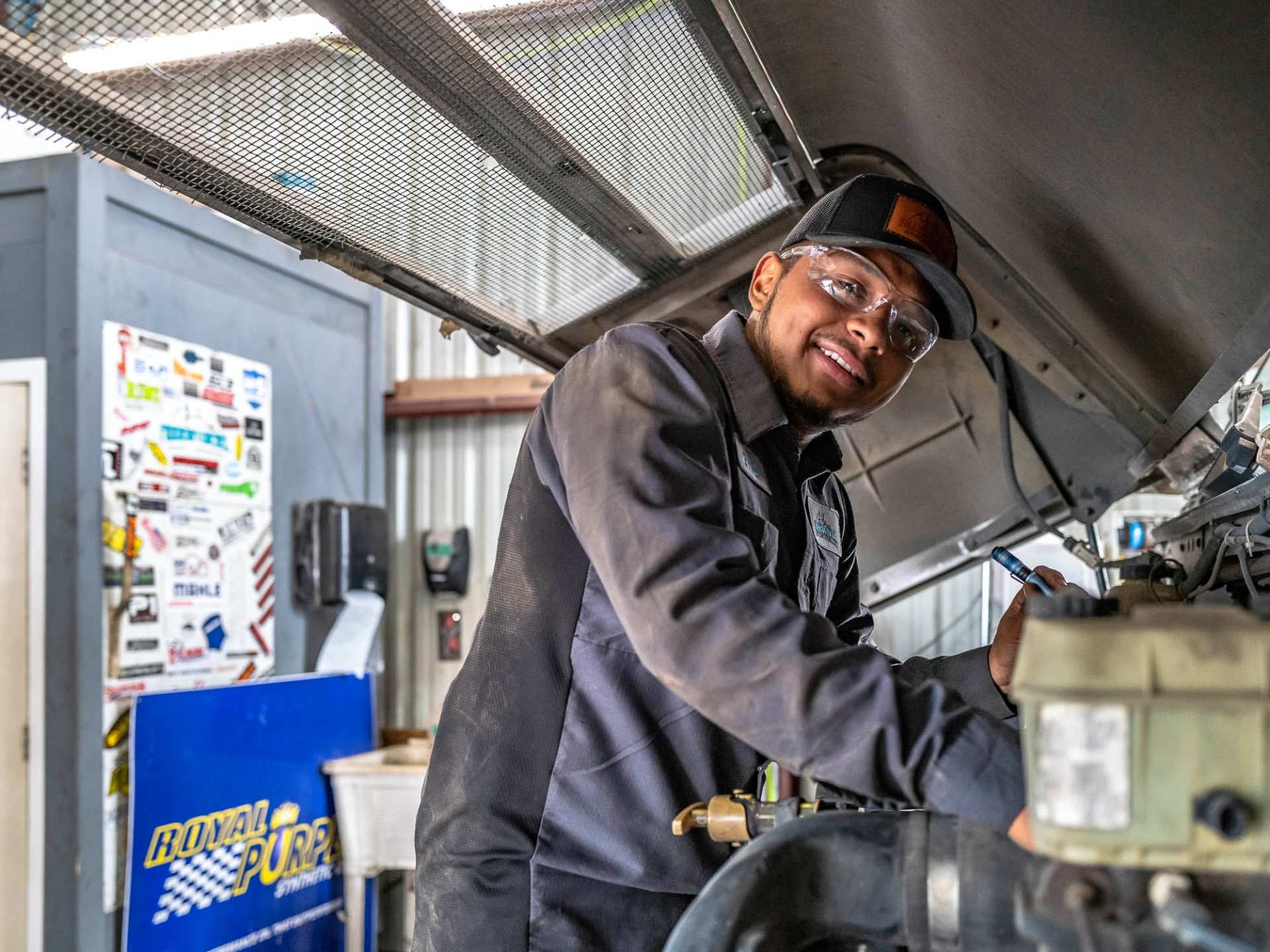 Modern Diesel technician working on a diesel engine in Austin, Texas